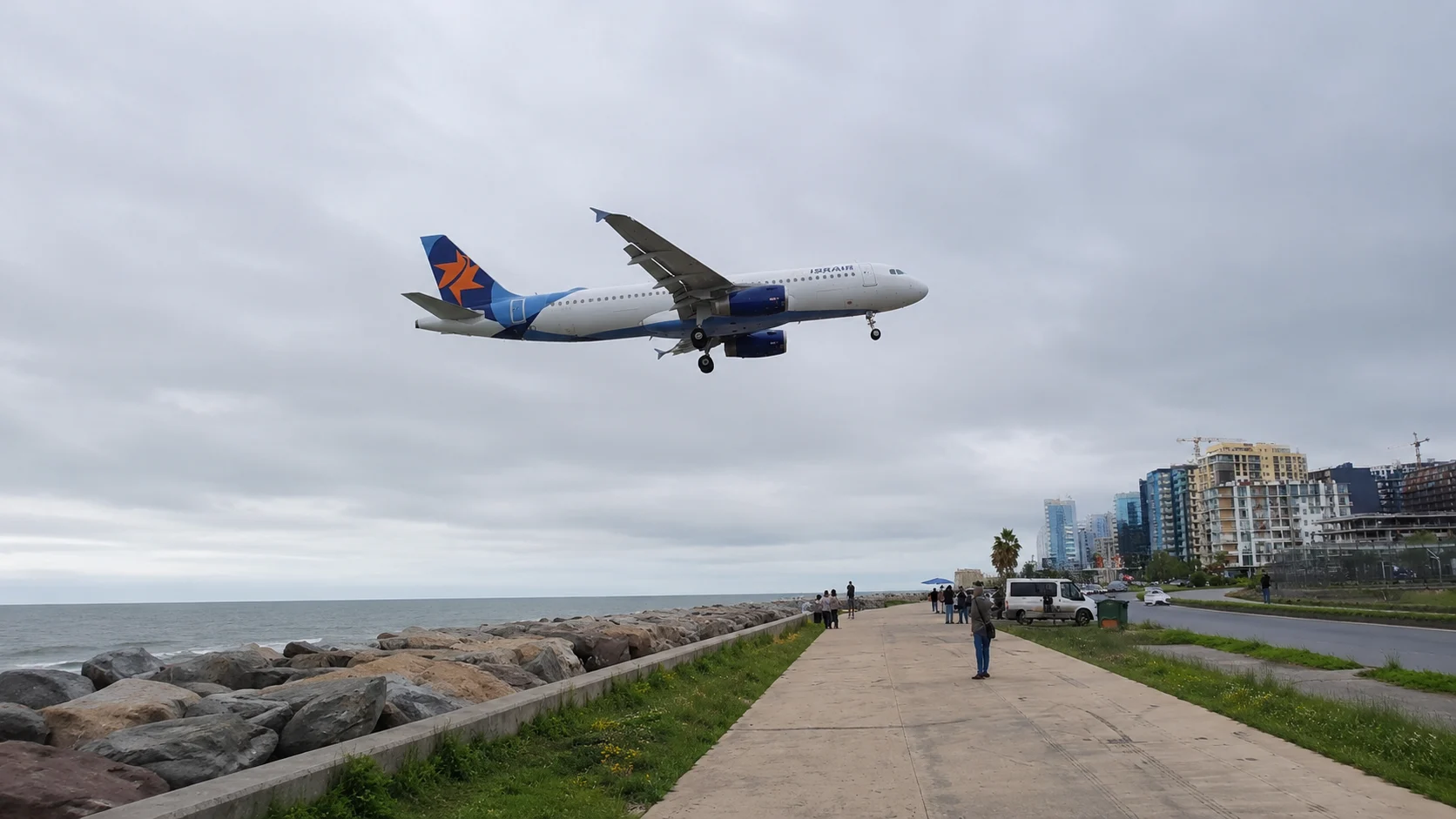 Plane low over Batumi shoreline